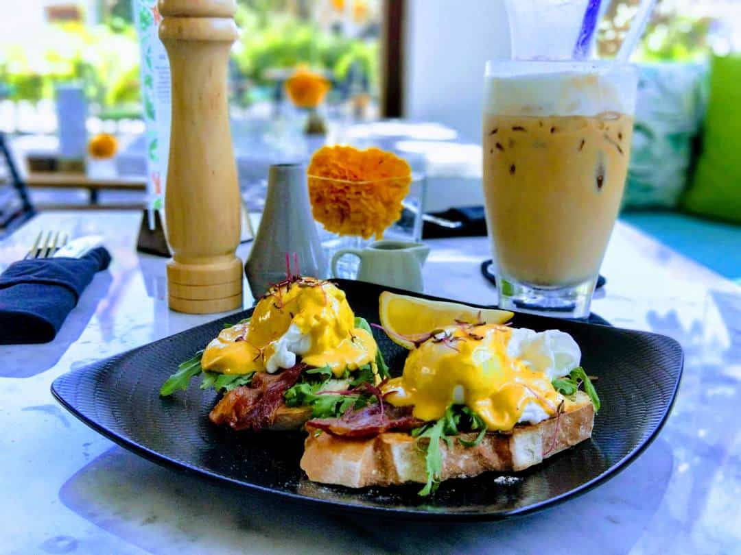 Eggs benedict in Sanur Bali — a popular breakfast choice at beach cafes along the Sanur beach path