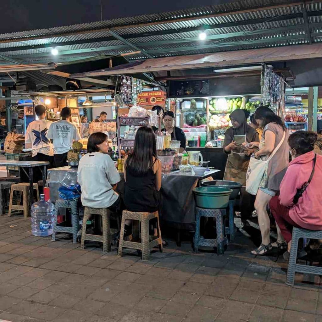 people sitting around tables at Sanur Night Market