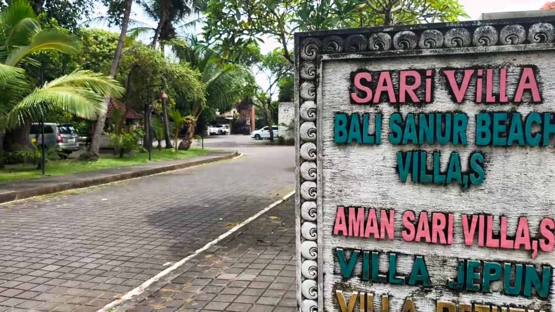 Sari Villa Sanur entrance sign with Griya Santrian Beach Resort in the background