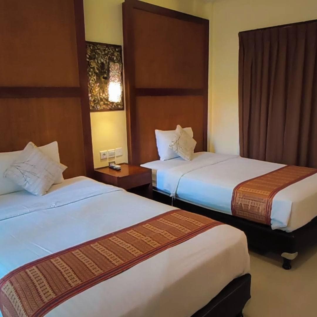 twin room with two king single beds at Sari Villa Sanur Bali